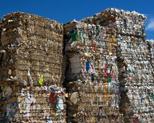 Bales of cardboard and paper ready to be recycled.